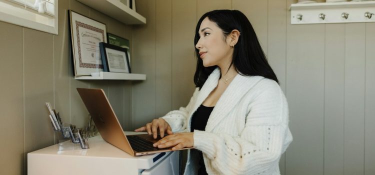 SEO Basics for Small Businesses: Where to Start A small business owner working on a laptop at a counter